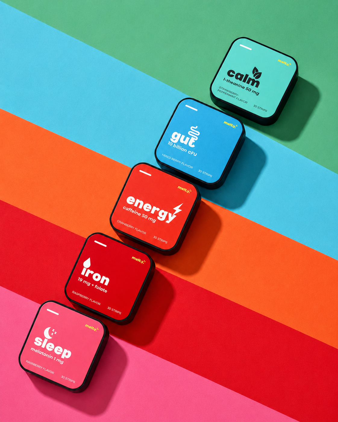 melty energy, gut, iron, calm and sleep vitamin strip containers arranged diagonally on colorful striped background